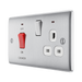 Metallic electrical switch with red button and multiple sockets on a white background side