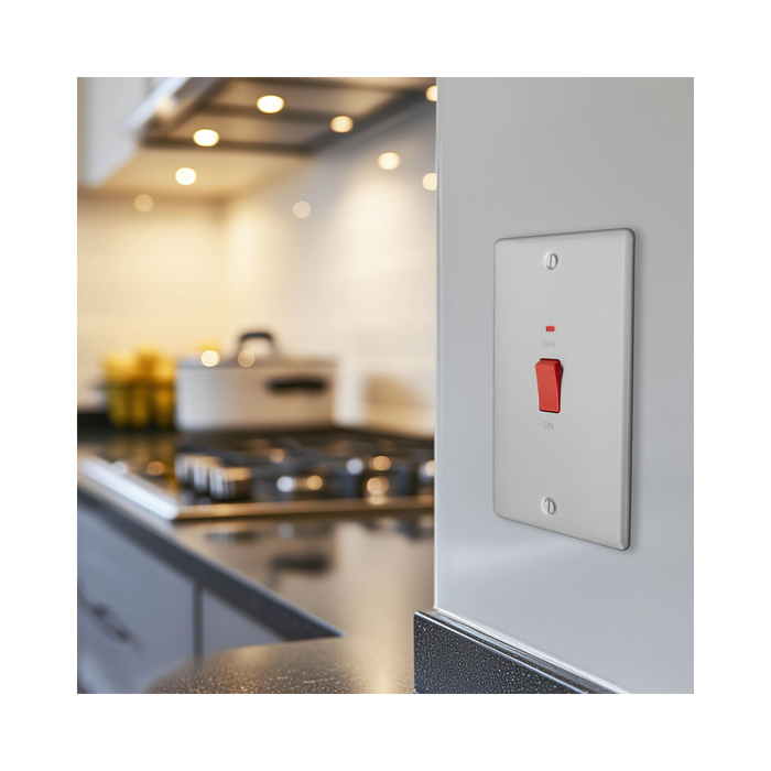 Metallic light switch with red button on a white background profile kitchen setting