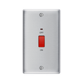 Metallic light switch with red button on a white background