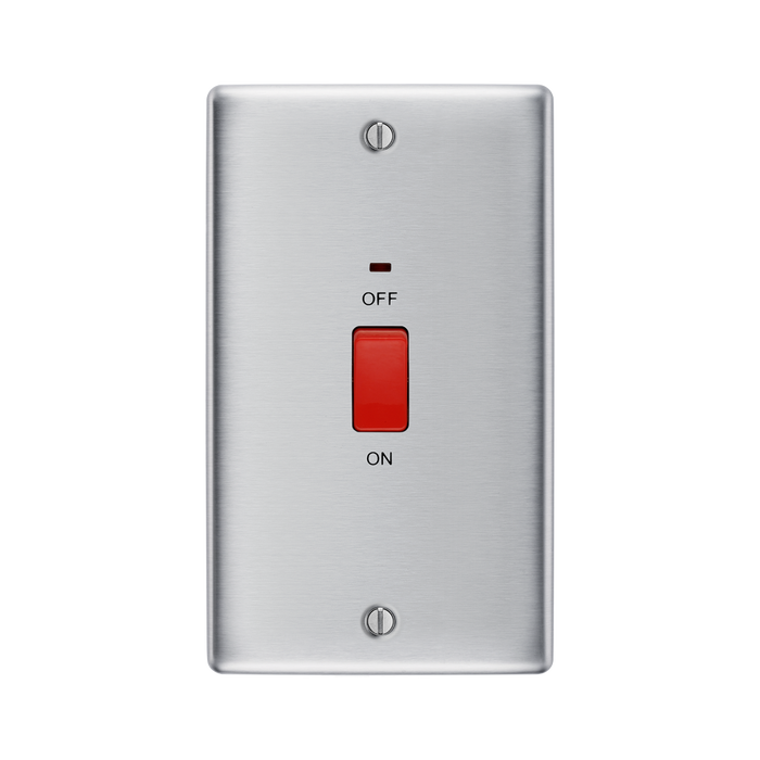 Metallic light switch with red button on a white background