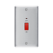 Metallic light switch with red button on a white background