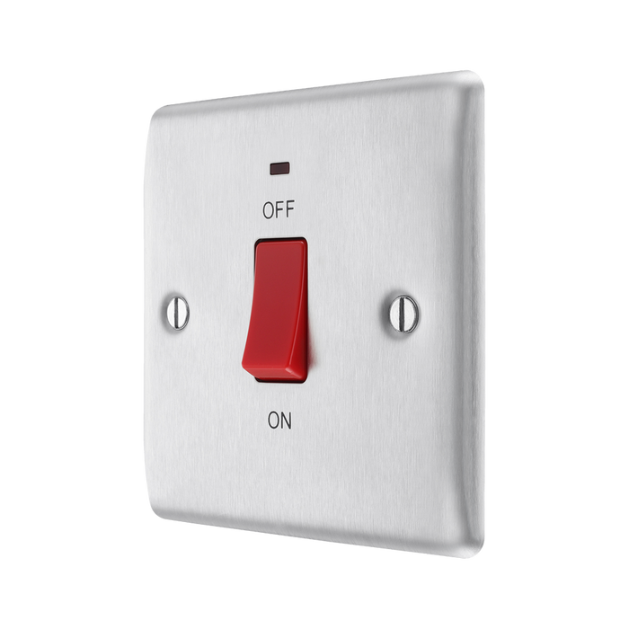 Metallic light switch with red toggle button on a white background side