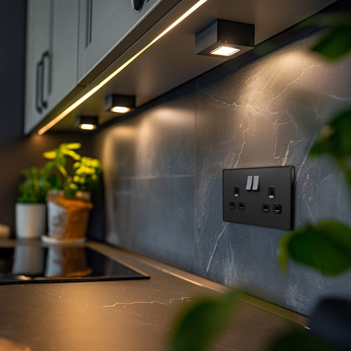 BG Evolve matt black 13A double socket PCDMB22B installed in a kitchen⠋