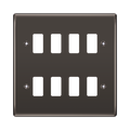 Black wall plate with eight white slots on a white background