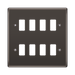 Black wall plate with eight white slots on a white background