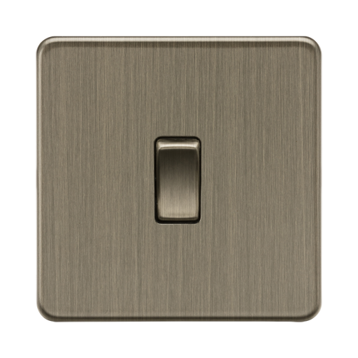 Antique Brass light switch with a single toggle on a white background