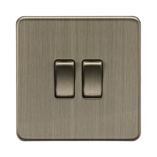 Antique Brass double switch on a white background