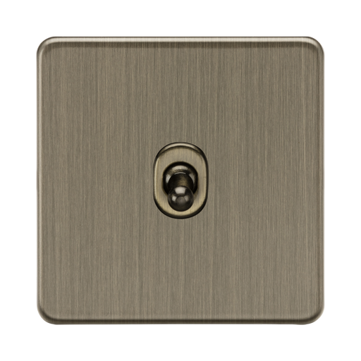 Antique Brass square light switch with central knob on a white background