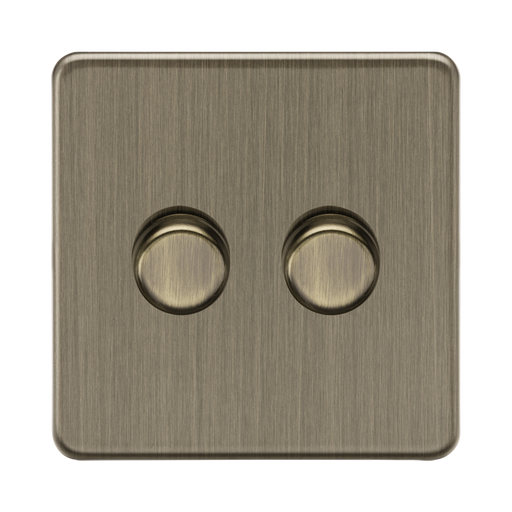 Antique Brass double switch on a white background