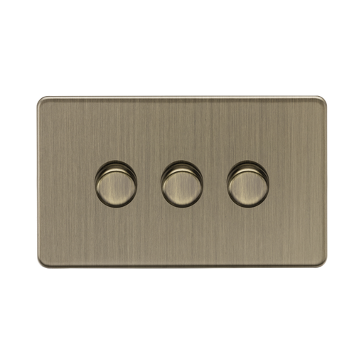 Antique Brass three dimmer knob light switch on a white background