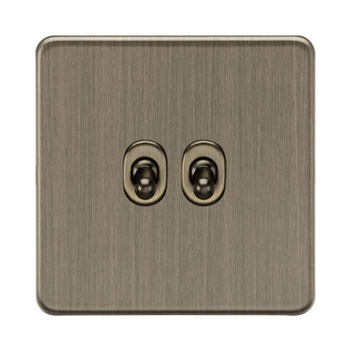 Antique Brass double socket switch on a white background