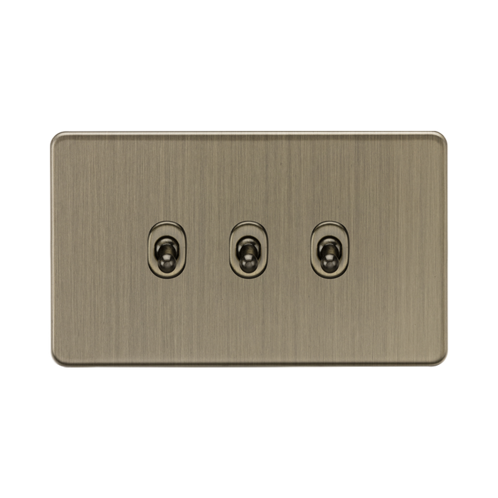 Antique Brass three-gang wall plate with sockets on a white background