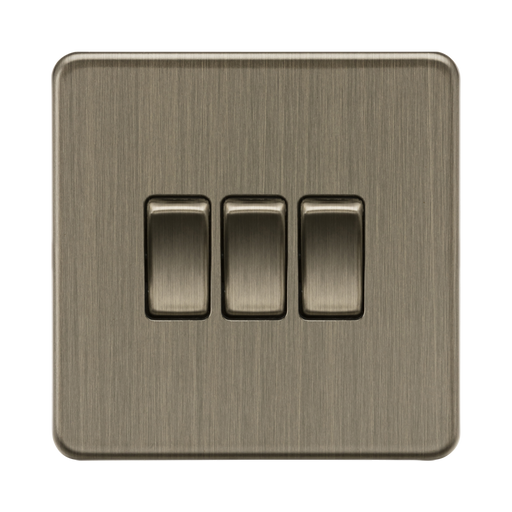 Antique Brass light switch with three buttons on a white background