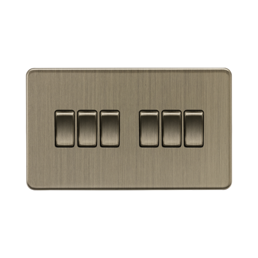 Antique Brass light switch with six rectangular buttons on a white background