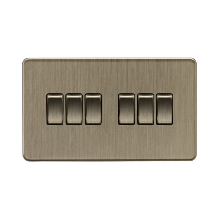 Antique Brass light switch with six rectangular buttons on a white background