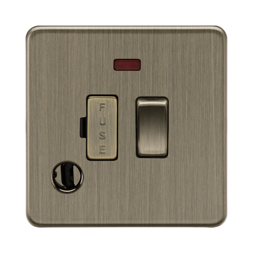 Antique Brass light switch with indicator on a white background