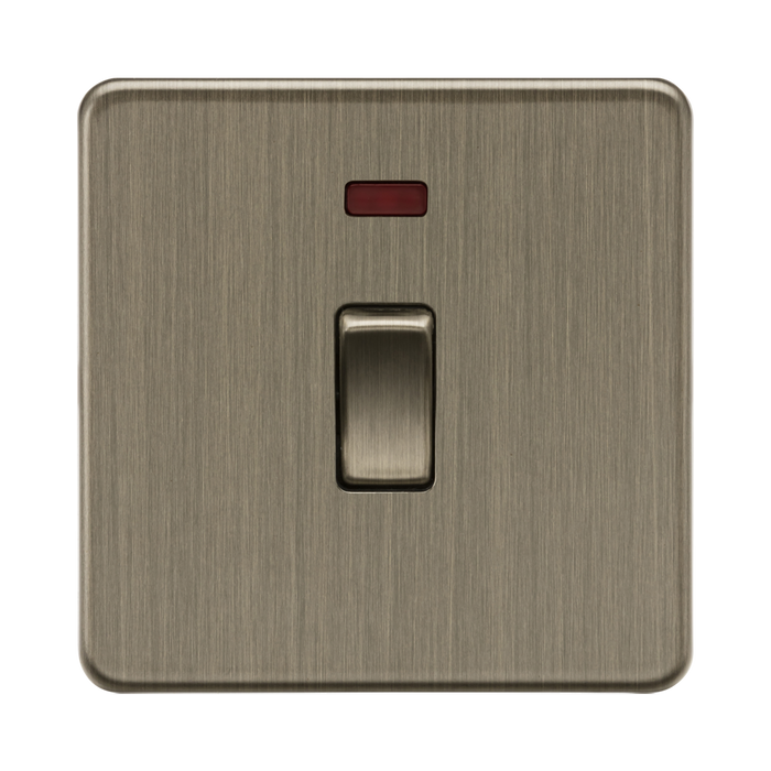 Antique Brass light switch with a red indicator on a white background