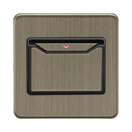 Antique Brass-coloured wall switch with black frame on a white background