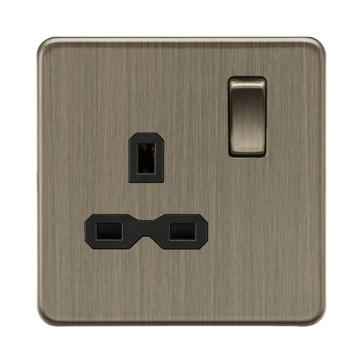 Bronze electrical socket with black inserts on a white background