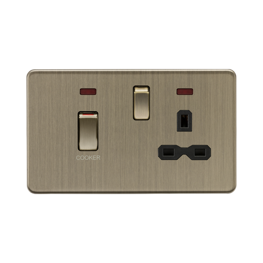Brass-colored electrical socket with switch on a white background