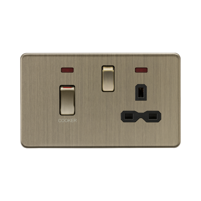 Brass-colored electrical socket with switch on a white background
