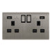 Metallic electrical socket with multiple ports on a white background