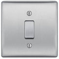 Metallic light switch on a white background